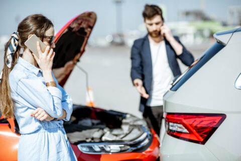 two people calling car lawyers after car accident